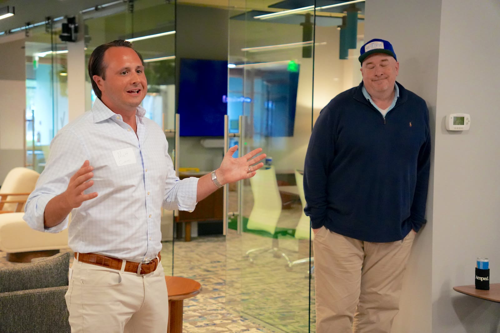 Matt Cimino gesturing while talking with another attendee at the August 27, 2026 AI Roundtable.